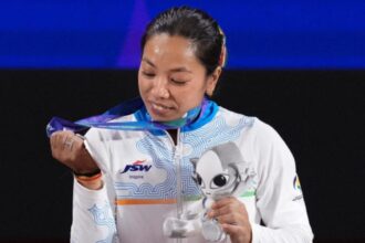 Mirabai Chanu celebrates after winning silver at Asian Games 2026