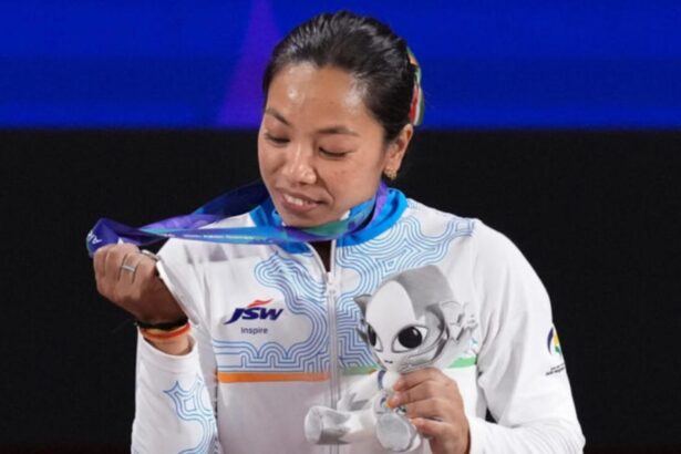 Mirabai Chanu celebrates after winning silver at Asian Games 2026
