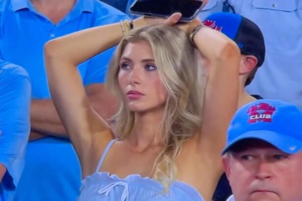 Ole Miss fan Sara Smith reacts during a college football game after going viral on ESPN