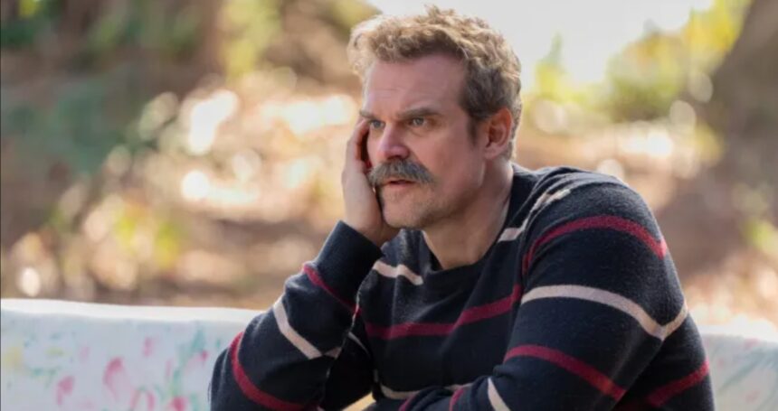 David Harbour holding his Emmy Award after winning for DTF St. Louis