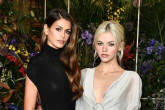 Kaia Gerber wearing a figure-hugging backless gown at a pre-Emmys party in Los Angeles