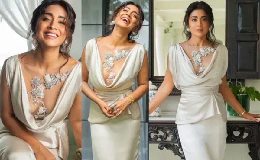 Shriya Saran poses in a striking white dress with statement pearl earrings