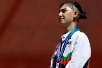 Fariba Hashimi celebrates after winning silver for Afghanistan at Asian Games 2026