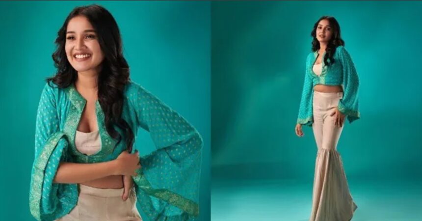 Anikha Surendran poses with a charming smile in a glamorous look