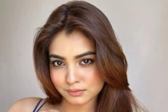 Hunterfly Pooja Singh 01 Pooja Singh poses in a deep-blue lace ensemble with soft waves