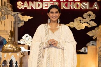 Sonam Kapoor wearing an ivory Abu Jani Sandeep Khosla anarkali with statement silver earrings