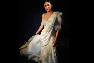 Mrunal Thakur wearing an ivory saree with a silver sequin blouse