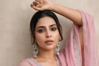 Aishwarya Lekshmi in a pink ethnic ensemble with silver jewellery