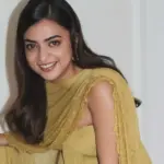 Nazriya Nazim wearing a green off-shoulder outfit at the Scene promotional event in Dubai