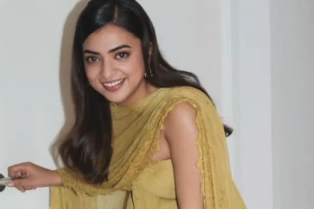 Nazriya Nazim wearing a green off-shoulder outfit at the Scene promotional event in Dubai