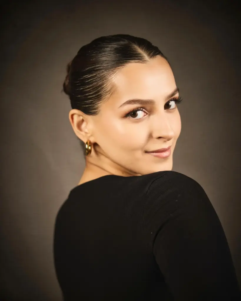 Slicked-Back Hair Completes the Look