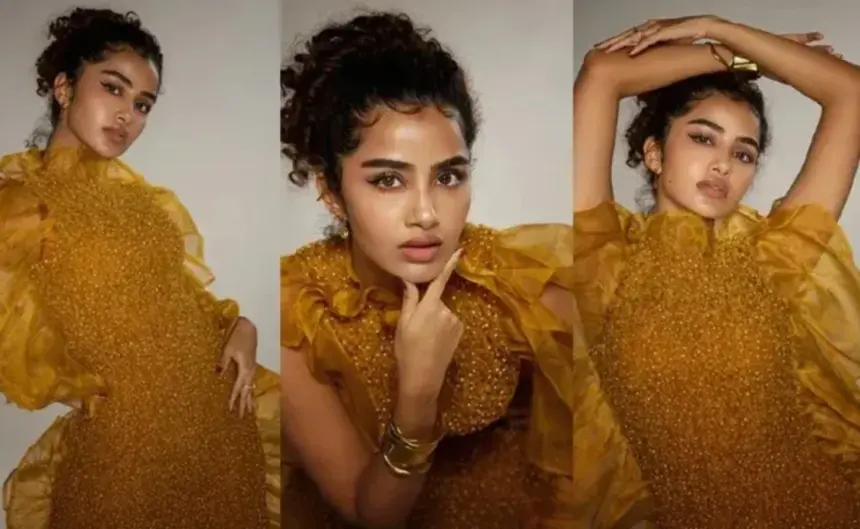 Anupama Parameswaran posing in a vibrant yellow dress during a photoshoot