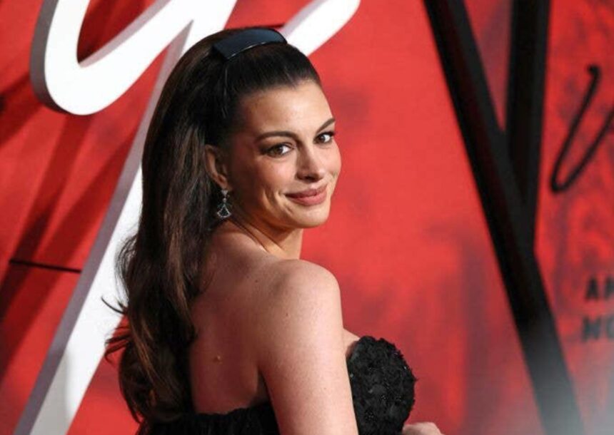 Pregnant Anne Hathaway wearing a sparkling black gown at the Verity premiere