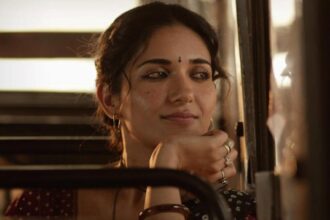 Ruhani Sharma seated beside a window in her Bijili character poster for Aakasamlo Oka Tara