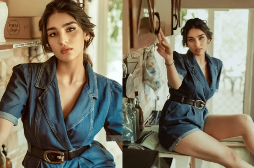 Woman wearing a chic structured denim jumpsuit