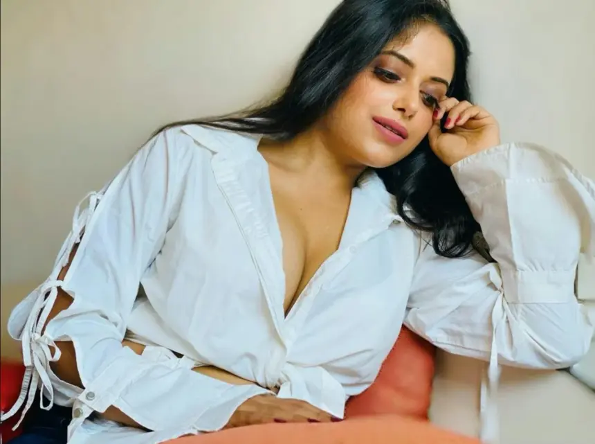 Sneha Paul wearing a white shirt in her latest photos
