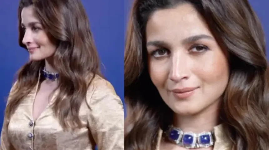 Alia Bhatt wearing a gold Banarasi jacket with matching trousers and a blue-stone choker