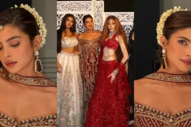 Priyanka Chopra wearing a burgundy gown with gold embroidery and a white jasmine gajra