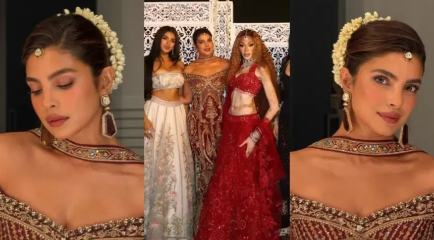 hunterfly priyanka chopra burgundy gold diwali gown Priyanka Chopra wearing a burgundy gown with gold embroidery and a white jasmine gajra